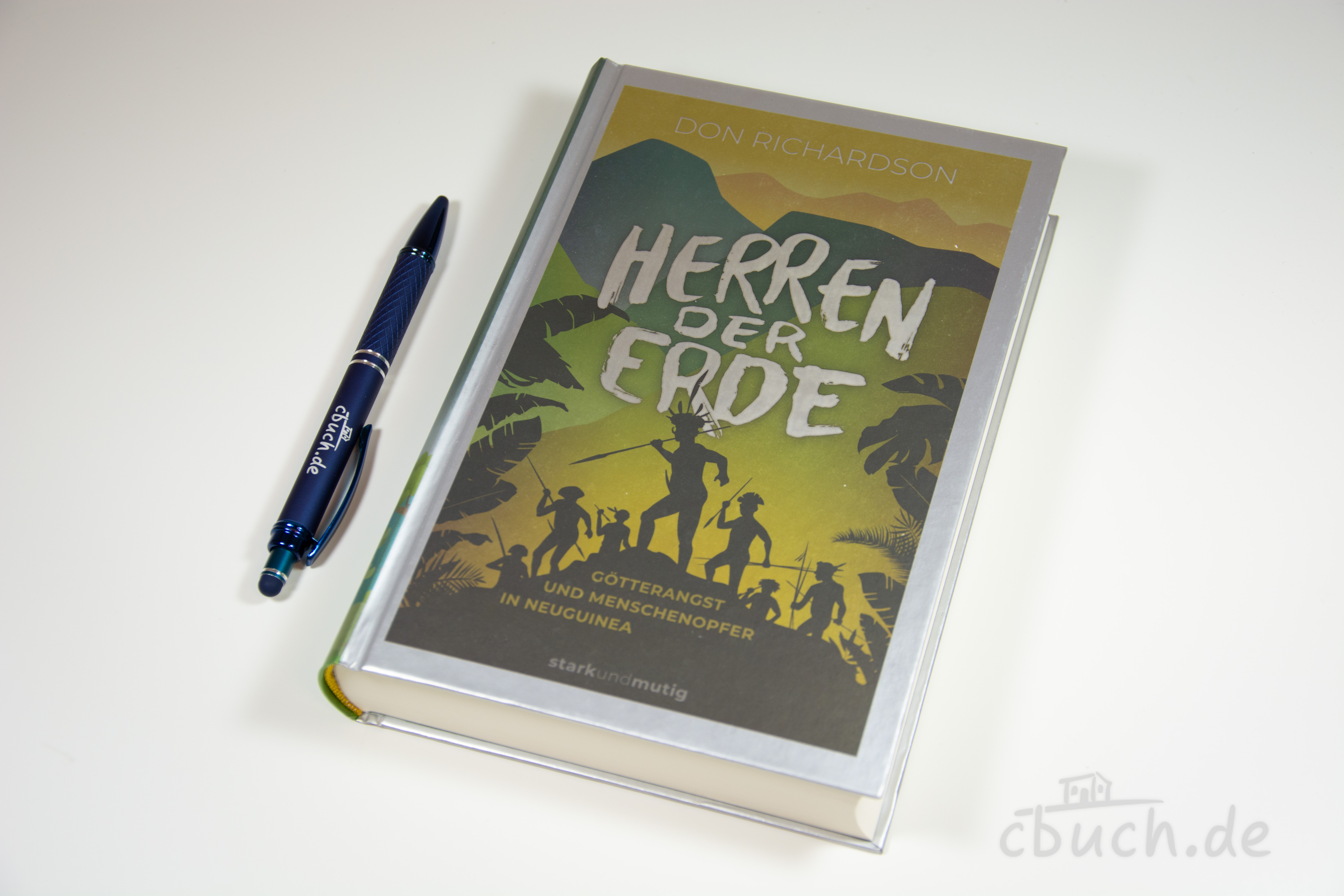 Buch Herren der Erde von Don Richardson mit blauer Kugelschr