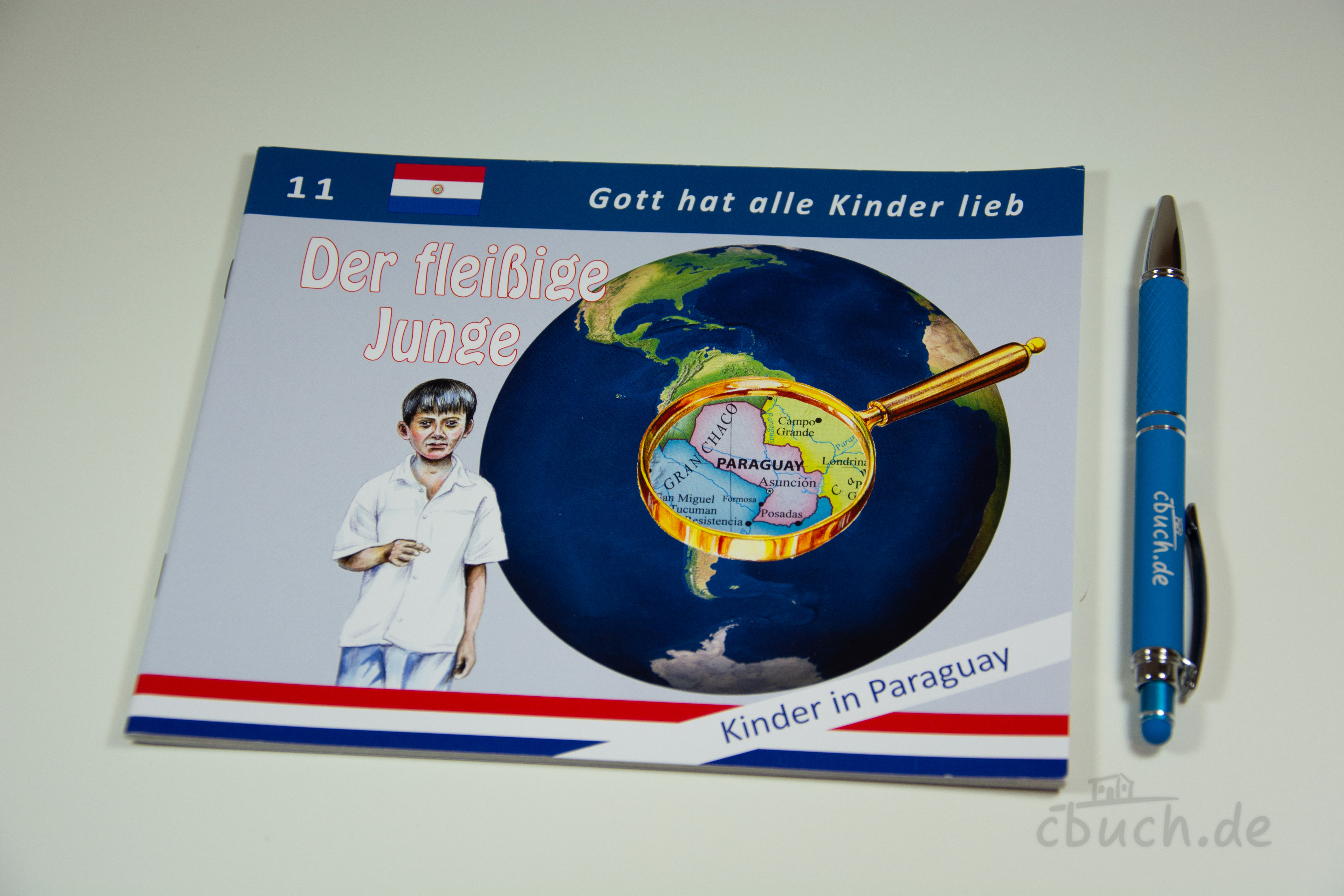 Cover des Kinderhefts Der fleißige Junge - Kinder in Paraguay (Heft 11) von Samenkorn, Missionsgeschichte über Pucho aus Asunción in Paraguay mit Weltkugel und Lupe